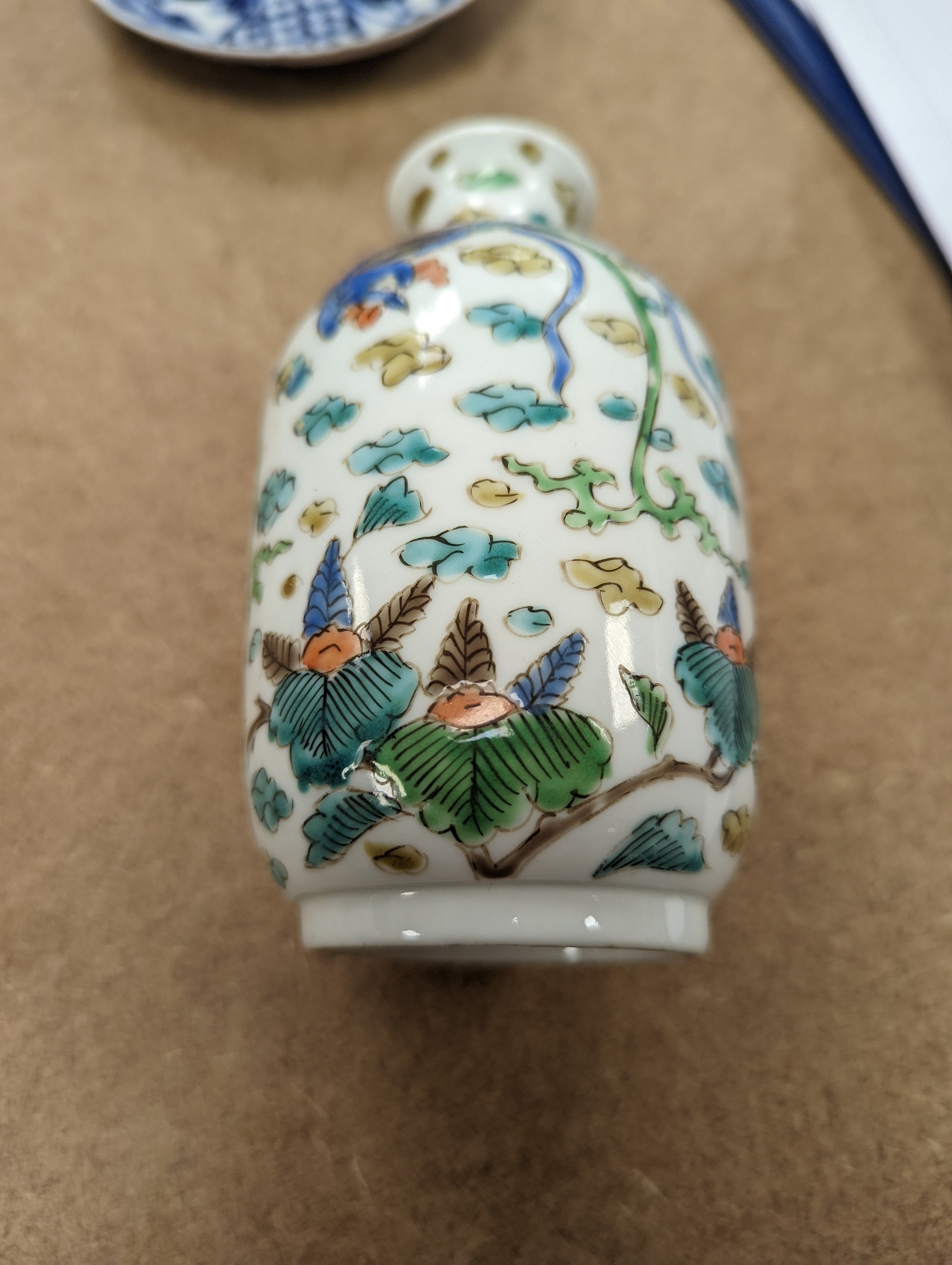 Two Chinese porcelain saucers, and a Chinese enamelled porcelain vase, 12.5cm., 18th century and later